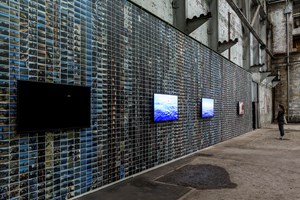 Cockatoo Island, Ai Weiwei, Series of photographs taken by Ai Weiwei during the filming of the documentary 'Human Flow' (2016). Wallpaper. Installation view: 21st Biennale of Sydney, Cockatoo Island, Sydney (16 March–11 June 2018). Courtesy the artist and neugerriemschneider, Berlin. Photo: Document Photography.